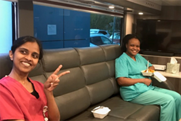 Staff taking a well earned break on the bus