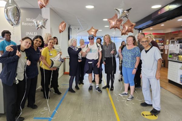 Group of staff with balloons 600x400 for website
